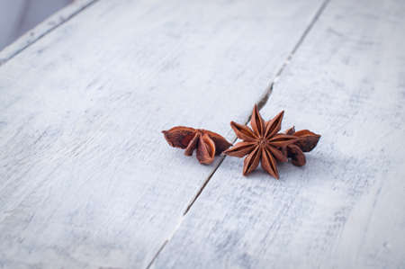 Anise on old white wooden backgroundの写真素材