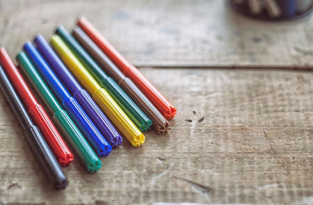 Colorful crayons on wooden table in nursery roomの写真素材