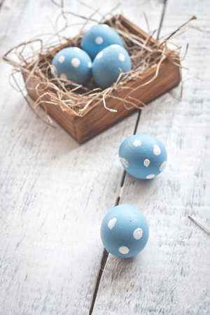 easter quail eggs decoration on wooden backgroundの写真素材