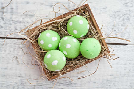 easter quail eggs decoration on wooden backgroundの写真素材