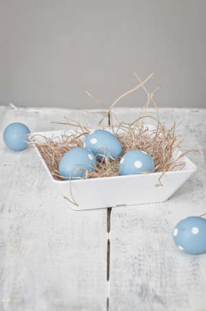 easter quail eggs decoration on wooden background