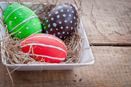 easter eggs decoration on wooden background