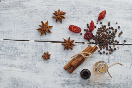 cinnamon, anis, pepper and two vialsの写真素材