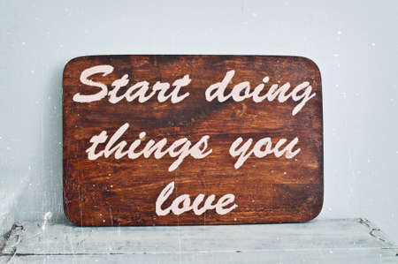 Motivating grunge wooden poster quote Start doingthings you love