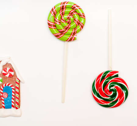 colorful lollipops and gingerbread on the white backgroundの写真素材