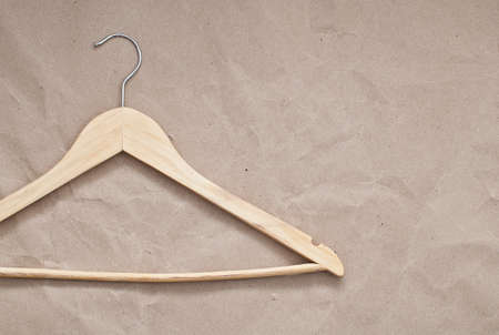Wooden hanger on craft paper backgroundの写真素材