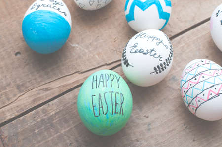 vintage easter eggs  background on old shabby wooden tableの写真素材