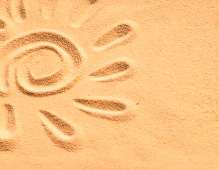 sand sun print on a beach in a summer sunsetの写真素材