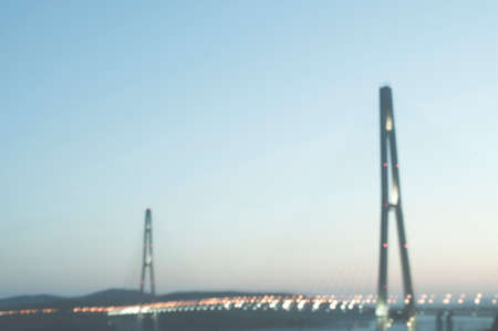 evening blurred sight with street lights, moody sky and bay bridge in Vladivostok russian islandの写真素材