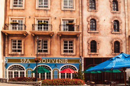 old street with stores and cafe in medieval villageのeditorial素材