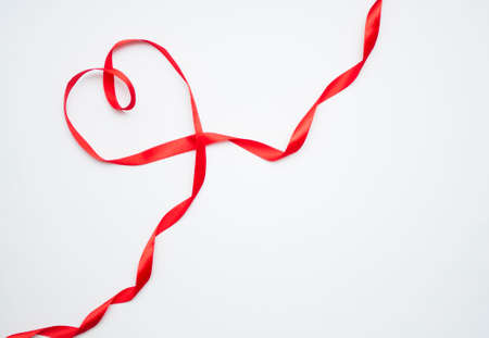 Happy Valentines Day. Red Ribbon Heart on white background. Valentines Day conceptの写真素材