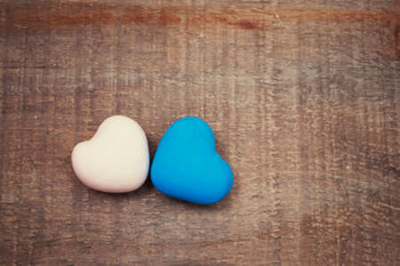 Two hearts are on rustic wooden backgroundの写真素材
