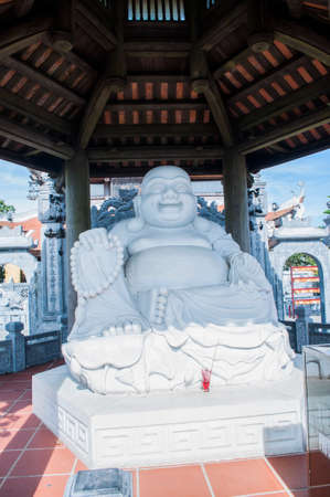 White statue of happy buddha  in vietnamese templeのeditorial素材