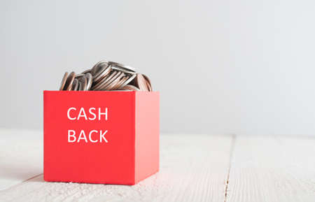 Cash back. Red gift box with coinsの写真素材