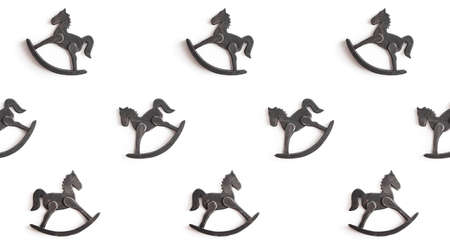 white background with wooden toy horse pattern for babyの写真素材