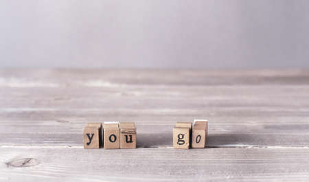 You go motivational words on grey wooden backgroundの写真素材