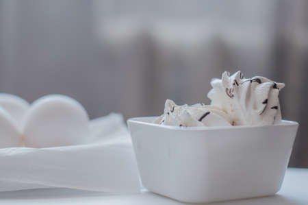 Protein breakfast, eggs and merinques on white kitchen tableの写真素材