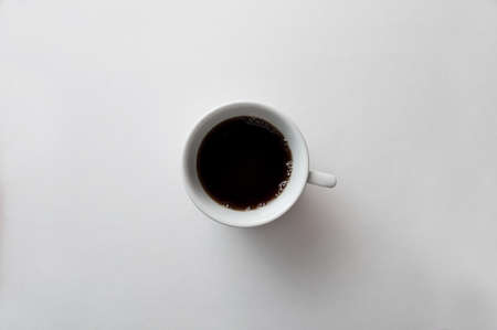 A cup of black coffee espresso on the white backgroundの写真素材