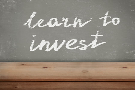 Learn to invest. Title of lesson in a school classroom for kidsの写真素材