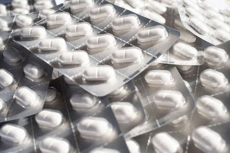 Tablets in blister packs close-up. Blurred background.の写真素材