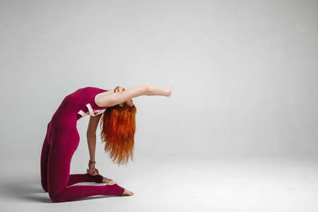 beautiful athletic girl shows yoga posesの写真素材