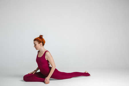 beautiful athletic girl shows yoga posesの写真素材