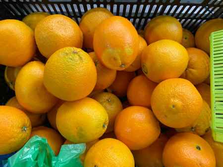 A pile of organic mandarin oranges random shape.の写真素材