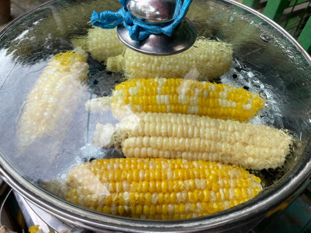 Boil yellow corn in pot
