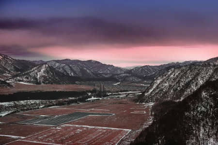 Beautiful mountain valley landscape at sunsetの写真素材