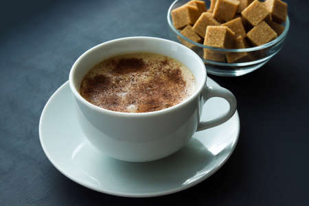Cup of coffee and sugar on table closeupの写真素材