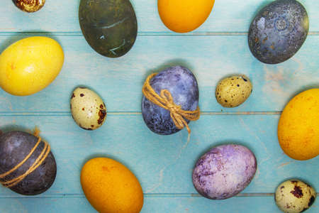 Colorful Ester eggs on wooden surface, top viewの写真素材