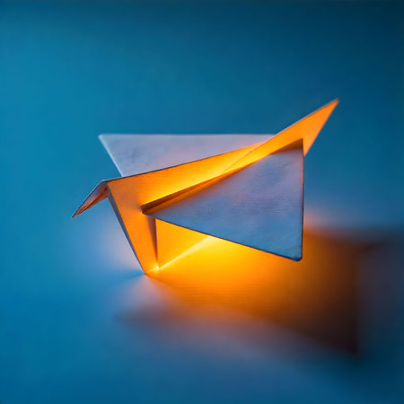 Paper origami airplane on the blue background. Origami concept.の素材