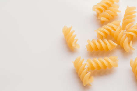 Dry Italian pasta on a white background.の写真素材