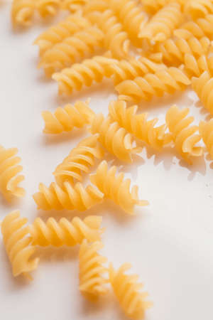 Dry Italian pasta on a white background.の写真素材