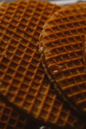 waffles with caramel on a black background close-up.の写真素材