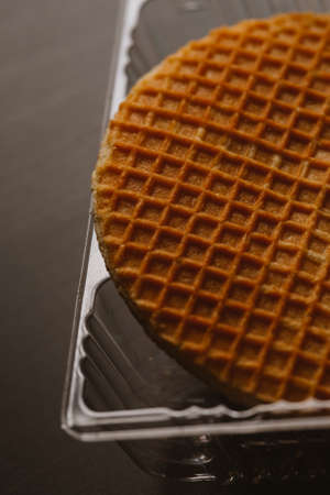 waffles with caramel on a black background close-up.の写真素材