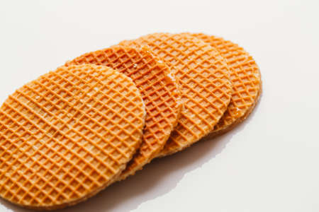 fresh waffles with caramel cookies on a white background.の写真素材