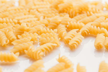 Dry Italian pasta on a white background.の写真素材
