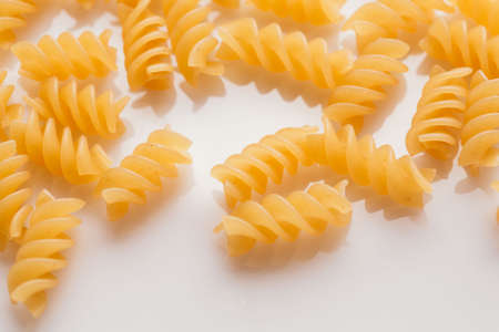 Dry Italian pasta on a white background.の写真素材