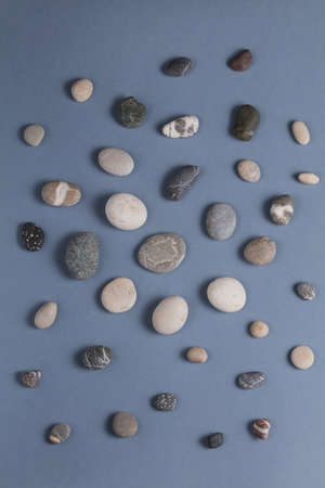 small stones for feet massage, wellness, wellbeing concepts . top view photo, fondness of natureの写真素材