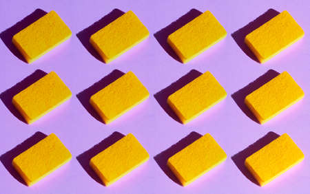 collection of yellow dusters on the blue table, top view photo, creative educational processの写真素材