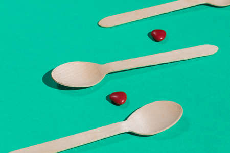 spoons and pillson the blue table, close up photoの写真素材