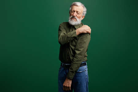 sick old man has pain in neck, senior man has shoulder dislocation. weak man suffering from strong...