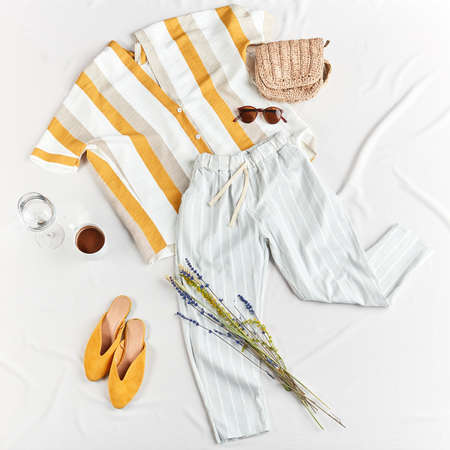 Female holiday clothes and accessories, flat lay, top view.fashion and design. summer outfit for holidaymakersの写真素材