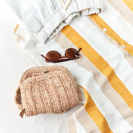 knitted bag suits with any summer clothes. collection of summer cothes in the shop, top flat layの写真素材