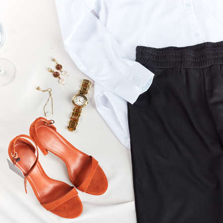 business woman has prepared clothes for office, trendy outfit for employees. comfortable red leather shoes for people who work for a lon time in the office, top viewの写真素材