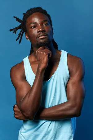strong muscular dancer making up a performance, movements, repper thinking about new words for song,...