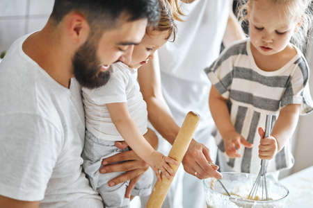 Family preparing pastry in the kitchen, close up cropped photo.lifestyle, free time, spare timeの写真素材