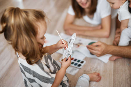 young cute girl making a new color, close up cropped photo. art , hobby, interestの写真素材