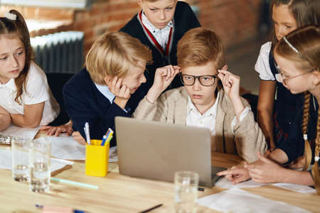 schoolchildren preparing presentation, doing homework, close up photo.mind, brain of company